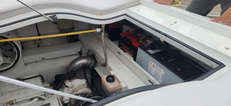 Catch And Release Yacht Photos Pics Engine compartment of a 2017 Trident Custom boat, showing batteries and mechanical components.