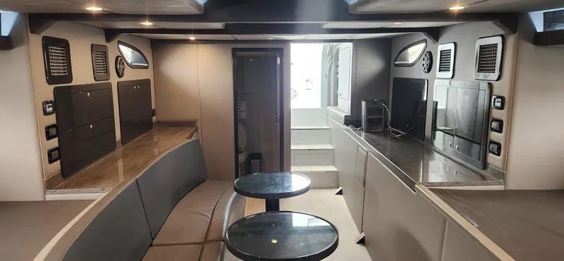 Catch And Release Yacht Photos Pics Luxurious interior of a 2017 Trident Custom yacht with modern seating and sleek design.