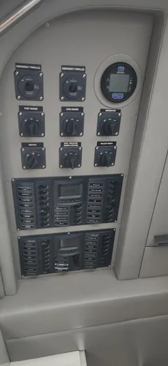 Catch And Release Yacht Photos Pics Control panel of a 2017 Trident Custom boat with switches and digital display.