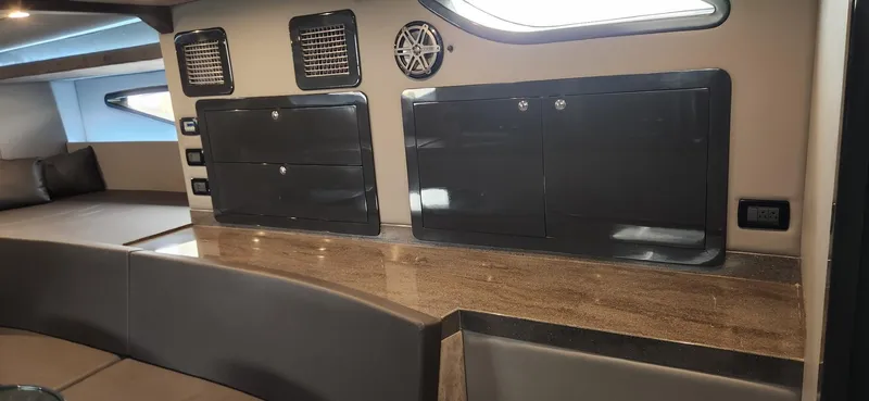 Catch And Release Yacht Photos Pics Interior of a 2017 Trident Custom boat with sleek cabinets and modern design.