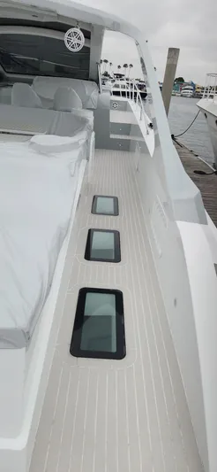 Catch And Release Yacht Photos Pics 2017 Trident Custom yacht deck with sleek design and modern windows, docked at marina.