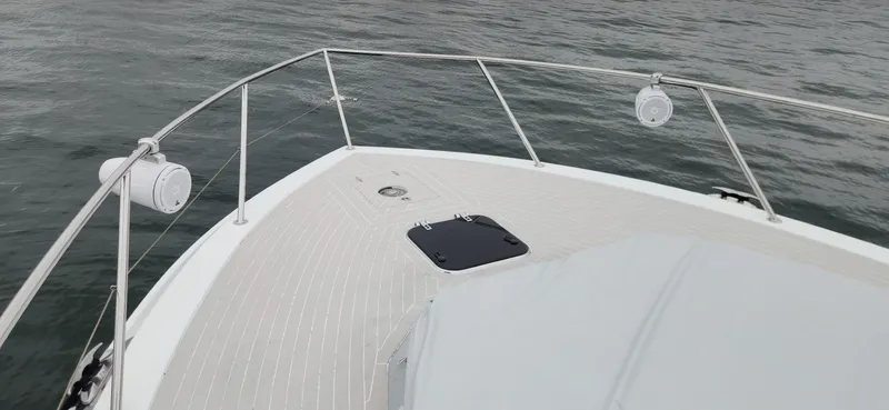 Catch And Release Yacht Photos Pics Bow of 2017 Trident Custom boat with speakers, railing, and ocean view.