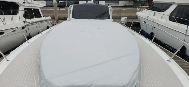 Catch And Release Yacht Photos Pics 2017 Trident Custom yacht docked at marina, covered deck, surrounded by other boats.