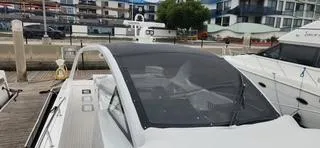 Catch And Release Yacht Photos Pics 2017 Trident Custom boat docked at a marina with modern buildings in the background.