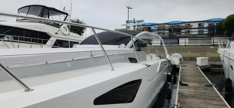 Catch And Release Yacht Photos Pics Luxury Trident Custom 2017 yacht docked at marina, showcasing sleek design and modern features.