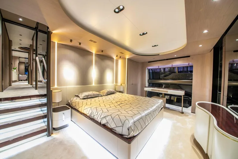 Nirvana By The Sea Yacht Photos Pics Luxurious bedroom interior of 2019 Azimut Grande 27 METRI yacht, featuring modern design and ambient lighting.