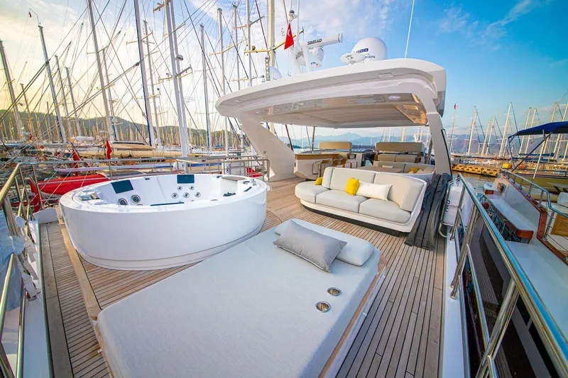Nirvana By The Sea Yacht Photos Pics Luxurious 2019 Azimut Grande 27 METRI yacht deck with jacuzzi and seating area.