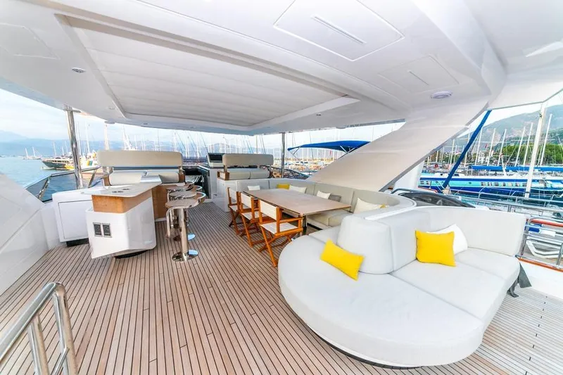Nirvana By The Sea Yacht Photos Pics Luxurious 2019 Azimut Grande 27 METRI yacht deck with elegant seating and scenic marina view.