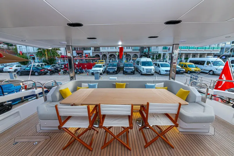 Nirvana By The Sea Yacht Photos Pics Azimut Grande 27 METRI 2019 yacht deck with dining area and city view.