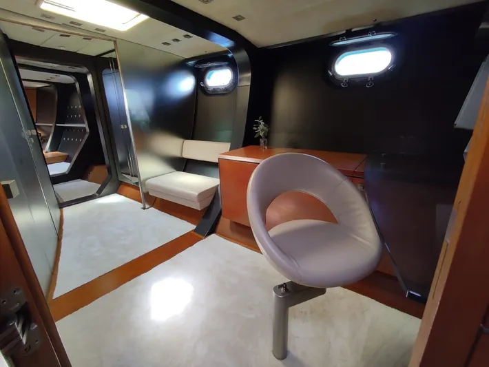  Yacht Photos Pics Luxurious yacht interior with modern seating, sleek design, and porthole windows, CMN 139, 1994 model.