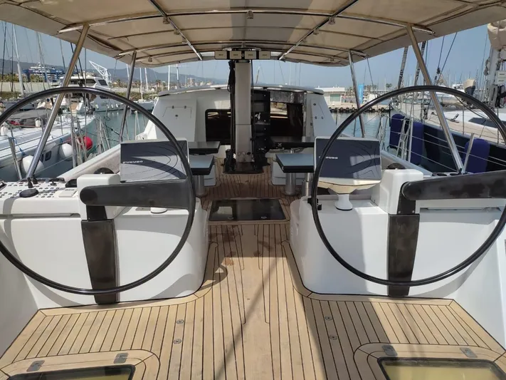  Yacht Photos Pics Spacious deck of 1994 CMN 139 yacht with dual steering wheels and seating area.