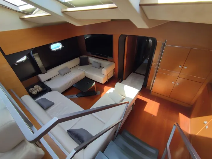  Yacht Photos Pics Luxurious yacht interior with modern white sofas, wooden flooring, and ample natural light. CMN 139, 1994.