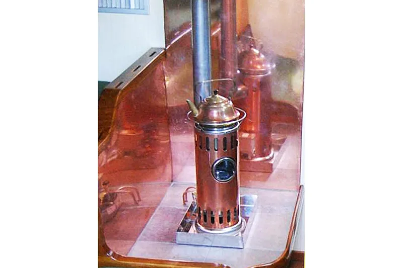 Jolie Brise Yacht Photos Pics Copper stove inside 1985 Sam L. Morse Bristol Channel Cutter 28 yacht.