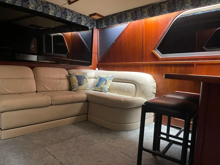 Kylieb Yacht Photos Pics Interior of 1986 Chris-Craft 422 Commander with leather seating and wooden paneling.