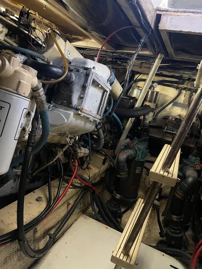 Kylieb Yacht Photos Pics Engine room of 1986 Chris-Craft 422 Commander with visible machinery and wiring.