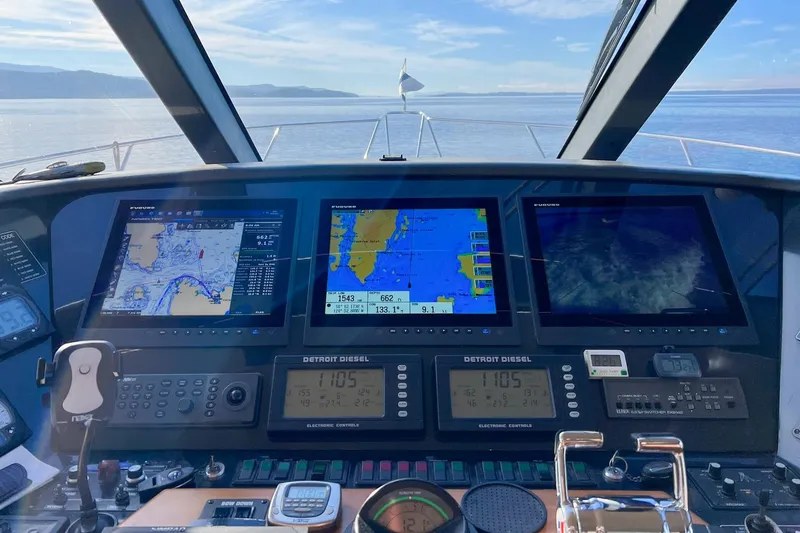 "mi Alma" Yacht Photos Pics Cockpit view of 2004 West Bay Sonship yacht with navigation screens and controls.