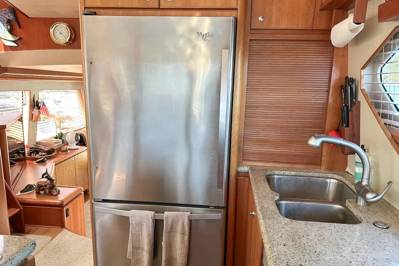 "mi Alma" Yacht Photos Pics 2004 West Bay Sonship yacht kitchen with stainless steel fridge and sink.