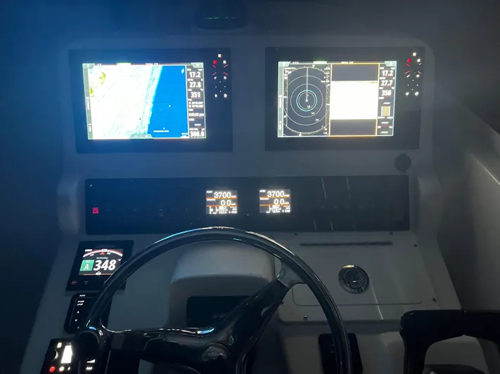 Sea Stress Yacht Photos Pics 2008 Pro-Line 32 Express boat dashboard with navigation screens and controls.