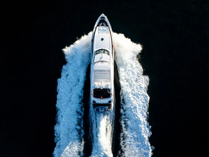 2010 Sunseeker Super Yacht Yacht Photos Pics Aerial view of 2010 Sunseeker 30m yacht cruising on open water.