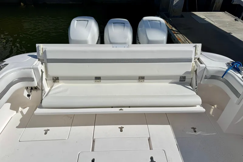  Yacht Photos Pics 2019 Intrepid 407 Cuddy boat with white seating and triple outboard engines.
