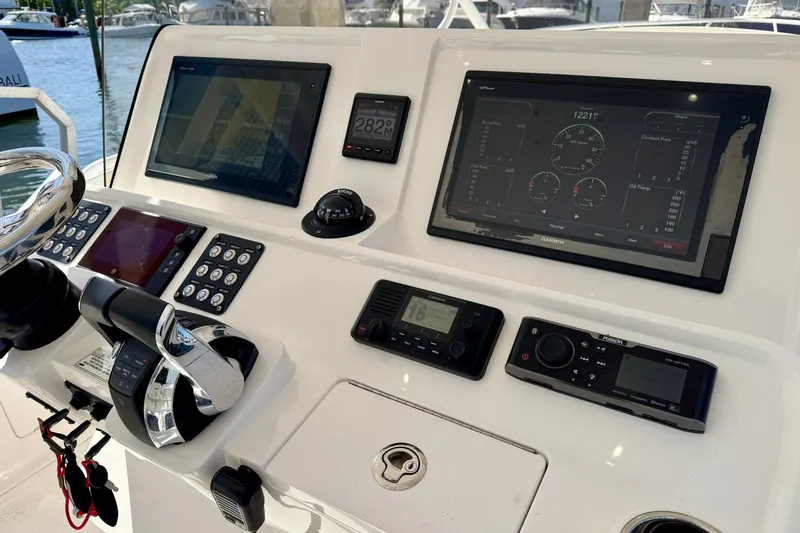  Yacht Photos Pics 2019 Intrepid 407 Cuddy helm with advanced navigation and control systems.
