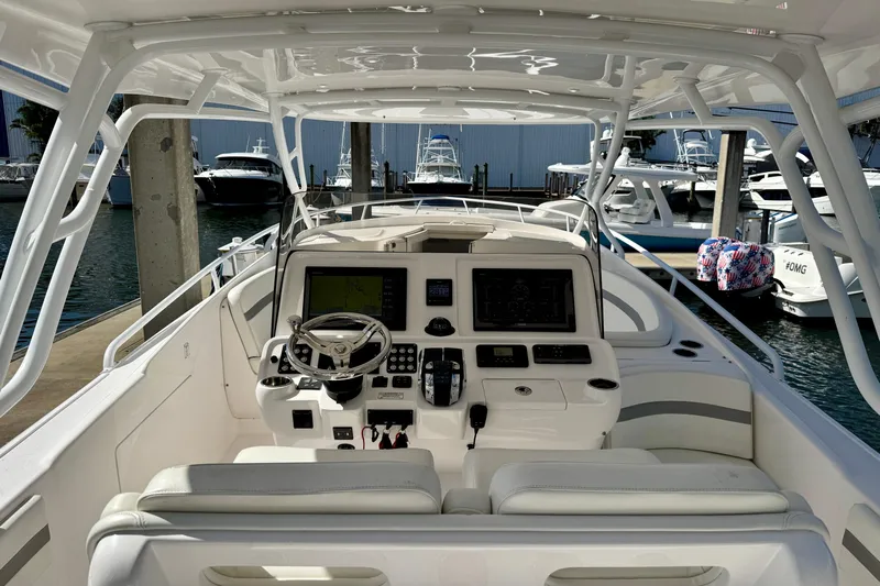  Yacht Photos Pics 2019 Intrepid 407 Cuddy boat interior with advanced navigation system at marina.