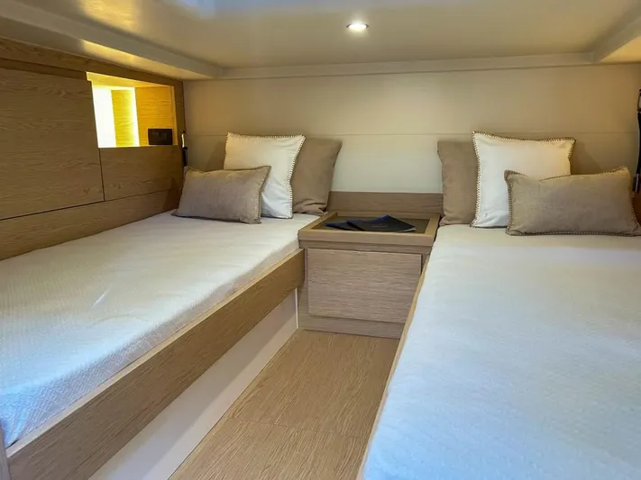 Yacht Photos Pics 2024 Solaris Power 40 Open cabin with twin beds and modern decor.