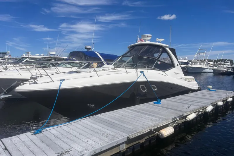 No Woke Zone Yacht Photos Pics 2008 Sea Ray 310 Sundancer docked at marina under clear blue sky.