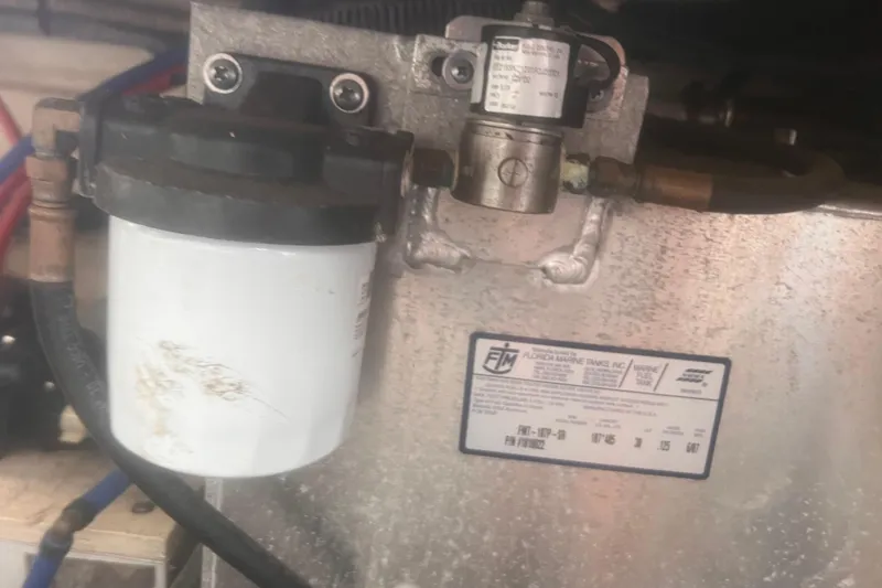 No Woke Zone Yacht Photos Pics Engine component of a 2008 Sea Ray 310 Sundancer boat, featuring a filter and metal tank.