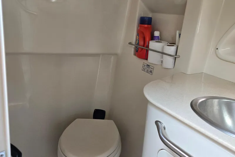 No Woke Zone Yacht Photos Pics Interior of 2008 Sea Ray 310 Sundancer bathroom with toilet and sink.