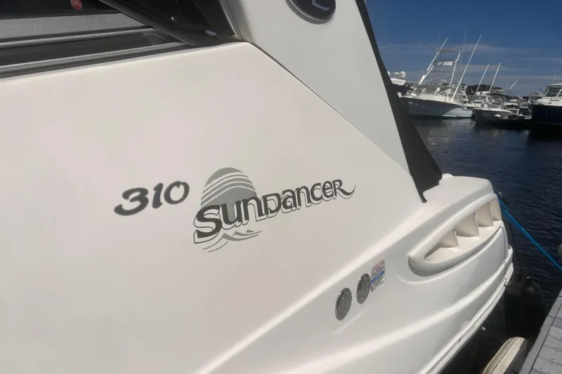 No Woke Zone Yacht Photos Pics 2008 Sea Ray 310 Sundancer boat docked at marina, showcasing sleek design and logo.