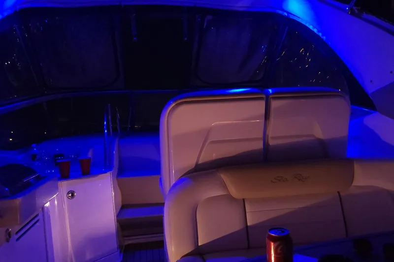 No Woke Zone Yacht Photos Pics 2008 Sea Ray 310 Sundancer interior with blue ambient lighting and seating area.