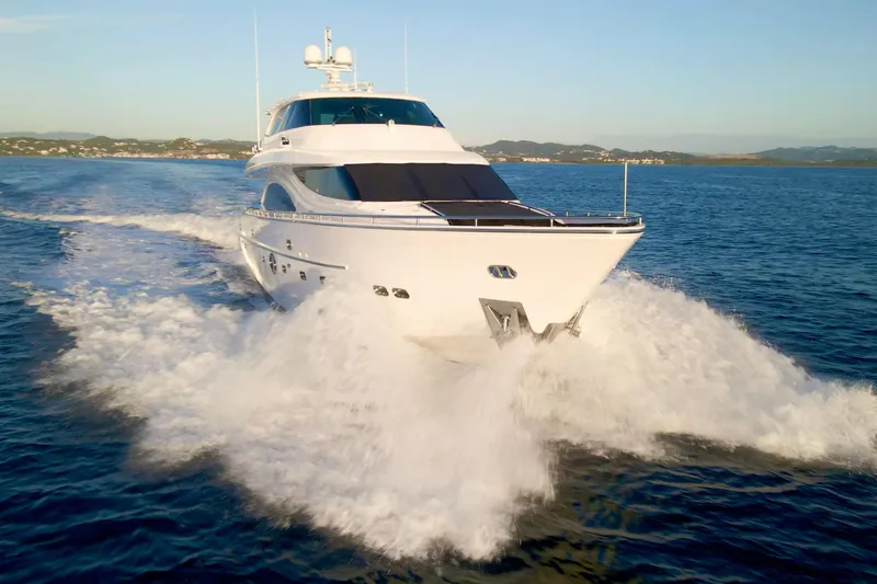 Tortuga Yacht Photos Pics Luxurious 2011 Horizon E88 yacht cruising swiftly on open water.