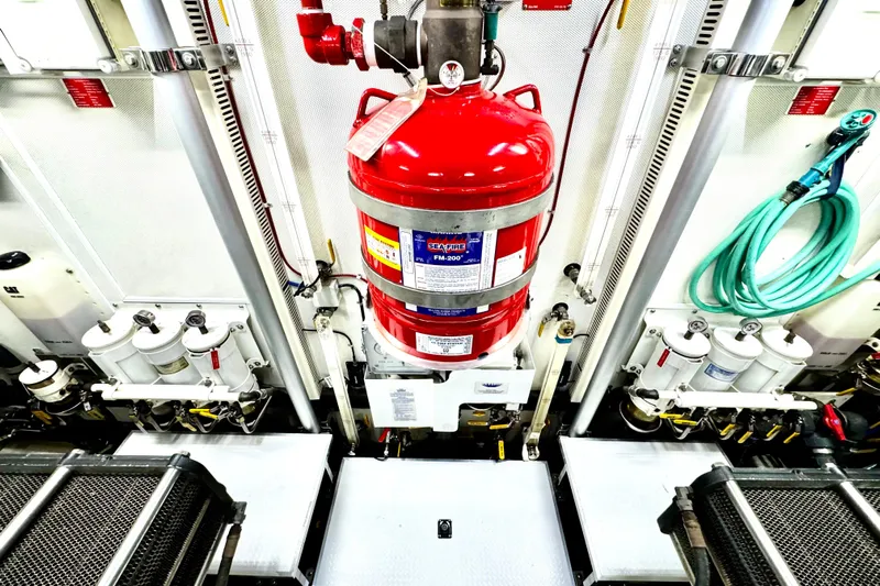 Tortuga Yacht Photos Pics Engine room of 2011 Horizon E88 yacht with fire suppression system and equipment.