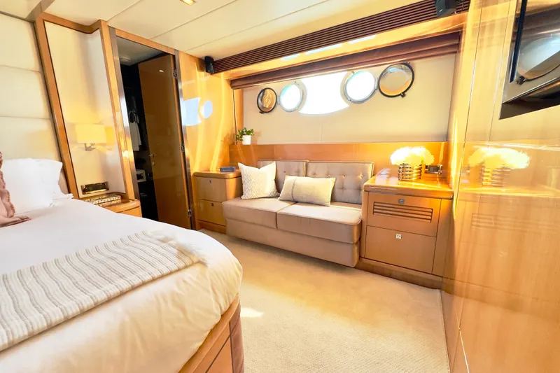 Tortuga Yacht Photos Pics Luxurious cabin interior of 2011 Horizon E88 yacht with elegant furnishings and porthole windows.