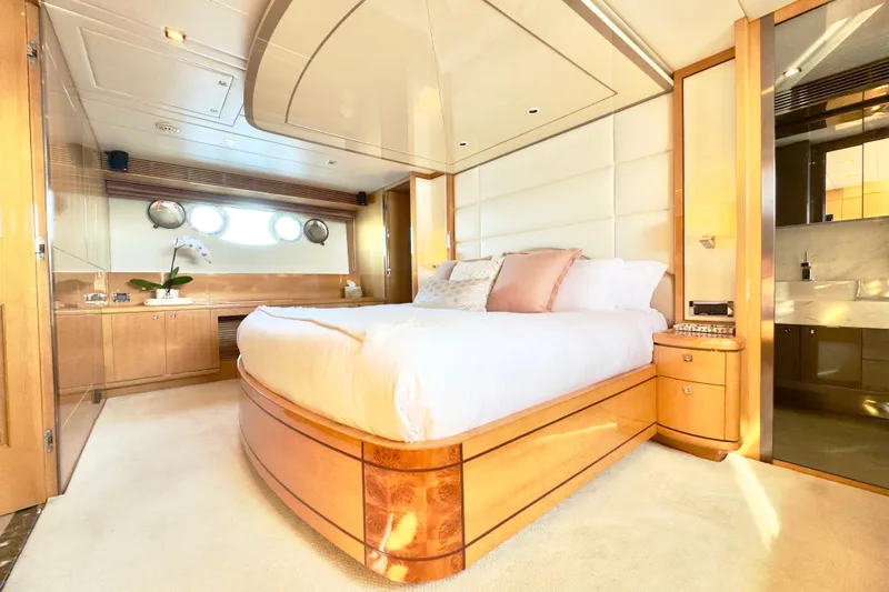 Tortuga Yacht Photos Pics Luxurious bedroom interior on 2011 Horizon E88 yacht with elegant wood finishes and plush bedding.