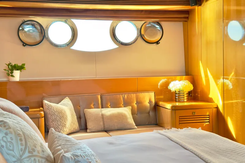 Tortuga Yacht Photos Pics Luxurious cabin interior of 2011 Horizon E88 yacht with elegant decor and porthole windows.