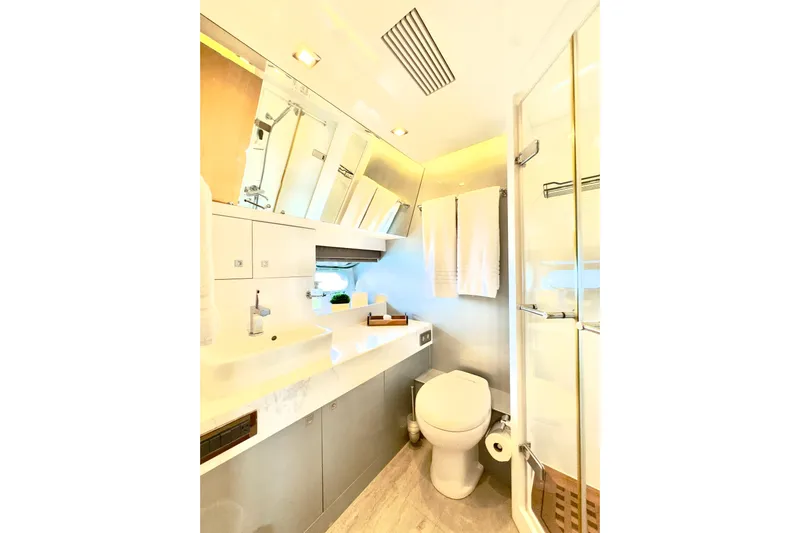 Tortuga Yacht Photos Pics Luxurious bathroom in 2011 Horizon E88 yacht with modern fixtures and elegant design.