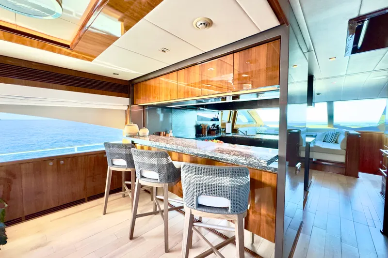Tortuga Yacht Photos Pics Luxurious Horizon E88 yacht interior with elegant bar and ocean view, 2011 model.