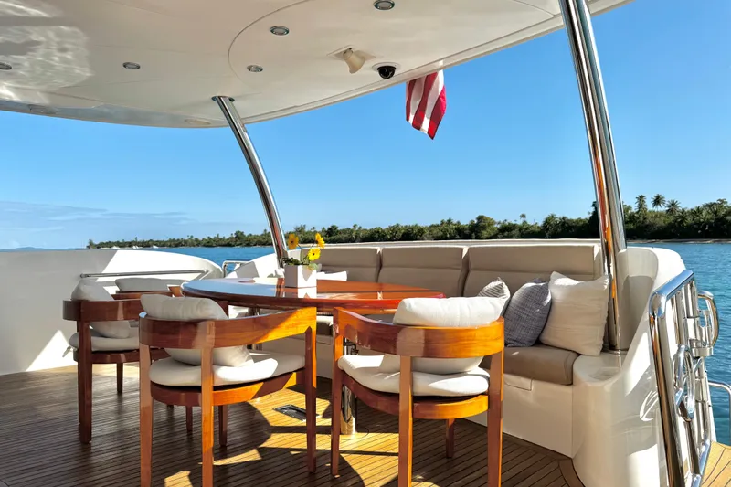 Tortuga Yacht Photos Pics Luxurious Horizon E88 yacht deck with elegant seating and ocean view, 2011 model.