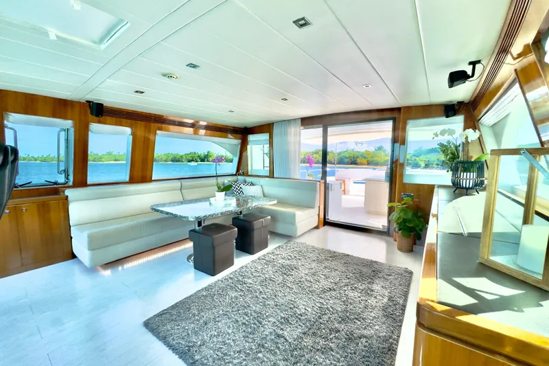 Tortuga Yacht Photos Pics Luxurious interior of 2011 Horizon E88 yacht with elegant seating and scenic views.