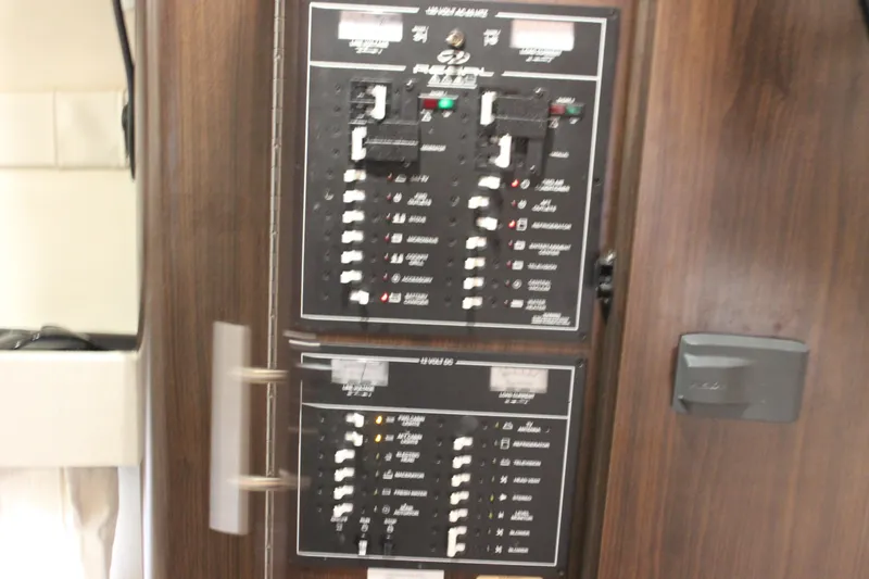  Yacht Photos Pics Electrical panel on a 2014 Regal 32 Express boat, featuring various switches and controls.
