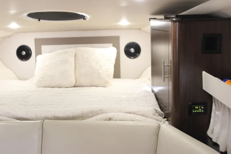  Yacht Photos Pics Luxurious cabin interior of 2014 Regal 32 Express yacht with cozy bedding.