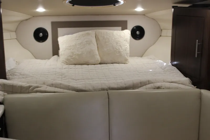  Yacht Photos Pics 2014 Regal 32 Express cabin interior with cozy bed and ambient lighting.