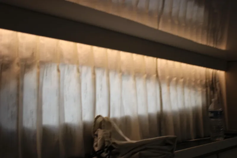  Yacht Photos Pics Interior view of 2014 Regal 32 Express with soft lighting and curtains.