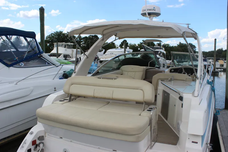  Yacht Photos Pics 2014 Regal 32 Express boat docked, featuring spacious seating and modern amenities.
