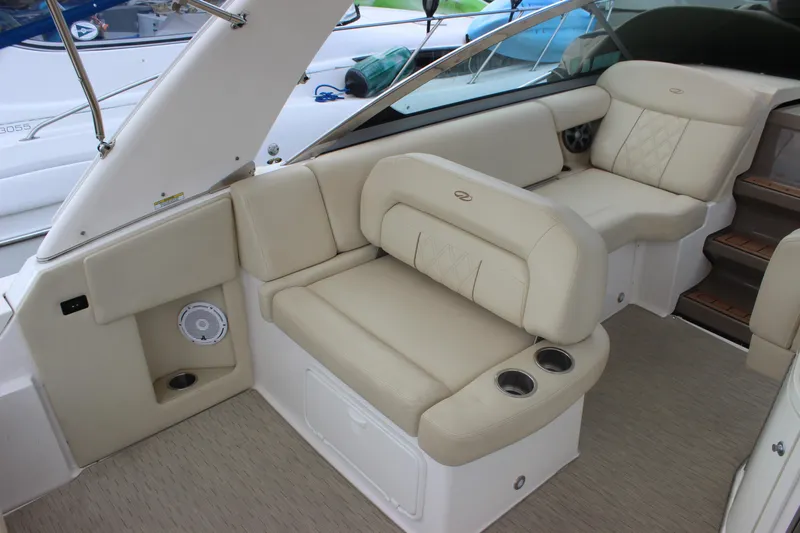  Yacht Photos Pics 2014 Regal 32 Express boat interior with beige seating and cup holders.