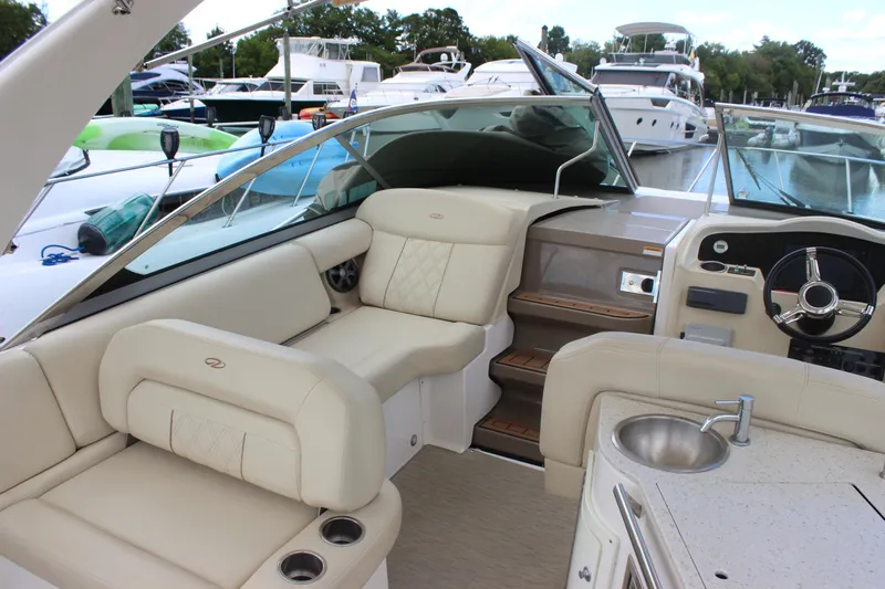  Yacht Photos Pics Interior of a 2014 Regal 32 Express boat with luxurious seating and helm.