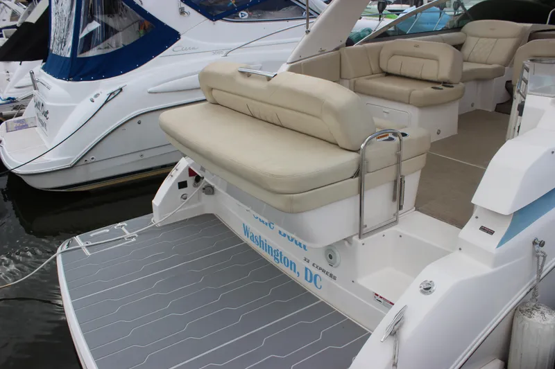  Yacht Photos Pics 2014 Regal 32 Express boat with beige seating, docked in Washington, D.C.