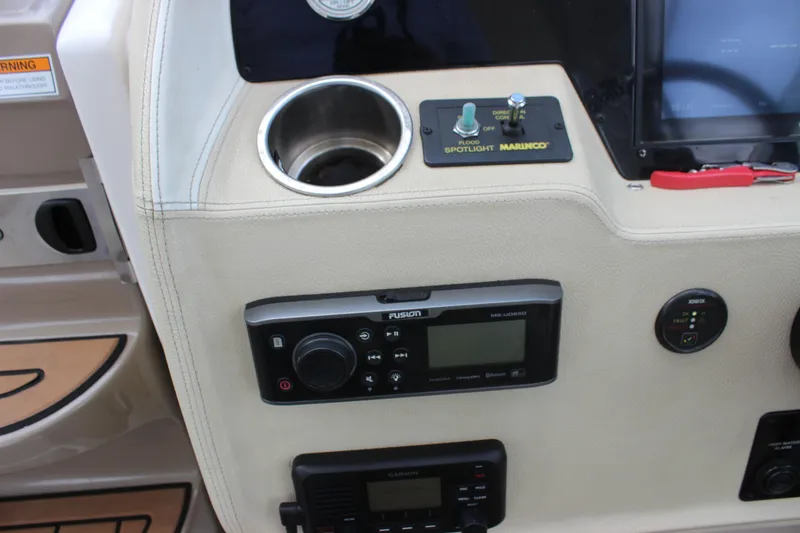  Yacht Photos Pics Control panel of 2014 Regal 32 Express boat with audio system and spotlight controls.